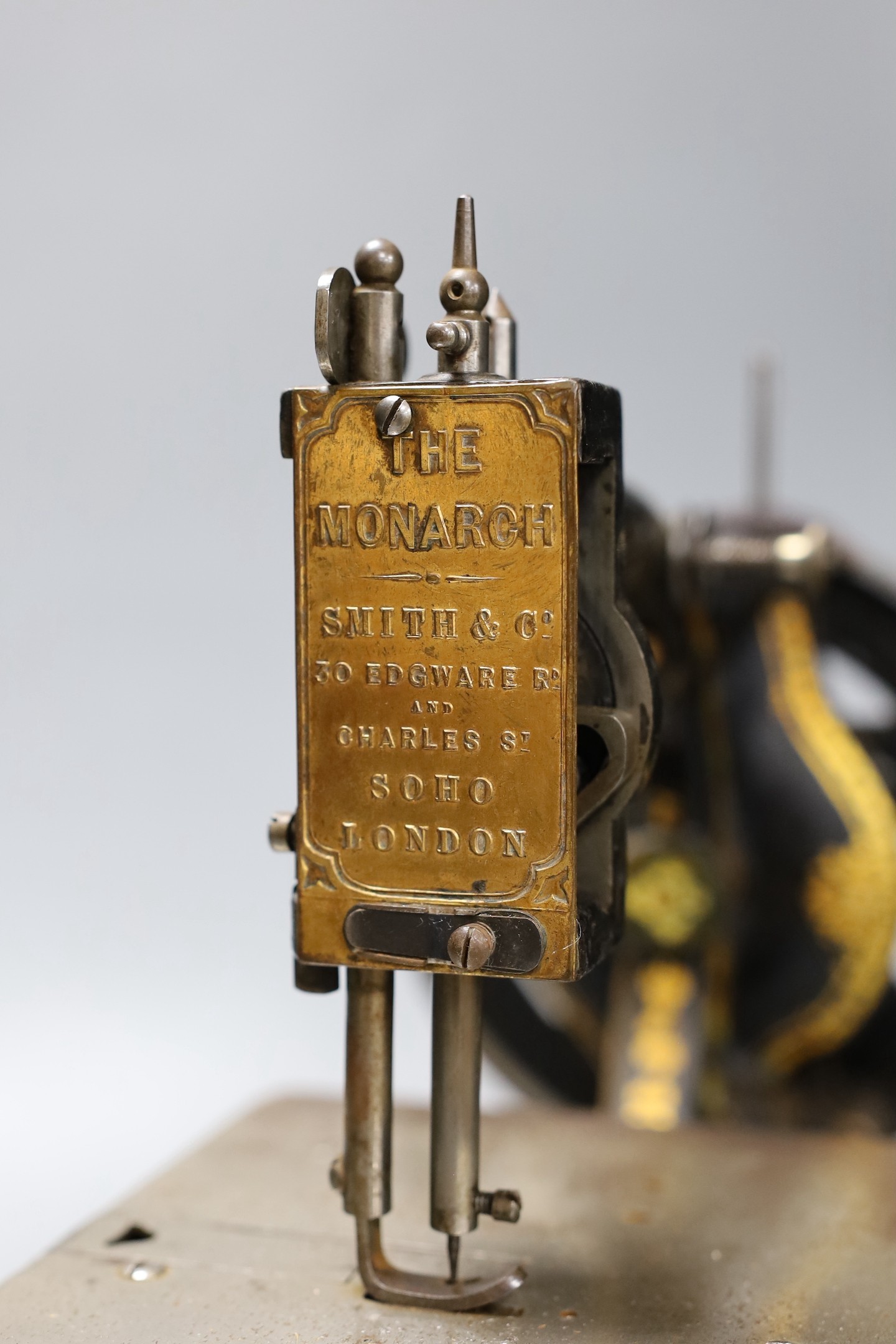 A Smith & Co. The Monarch sewing machine with original case and manual
